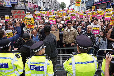 Counter protestors face off with police in Walthamstow